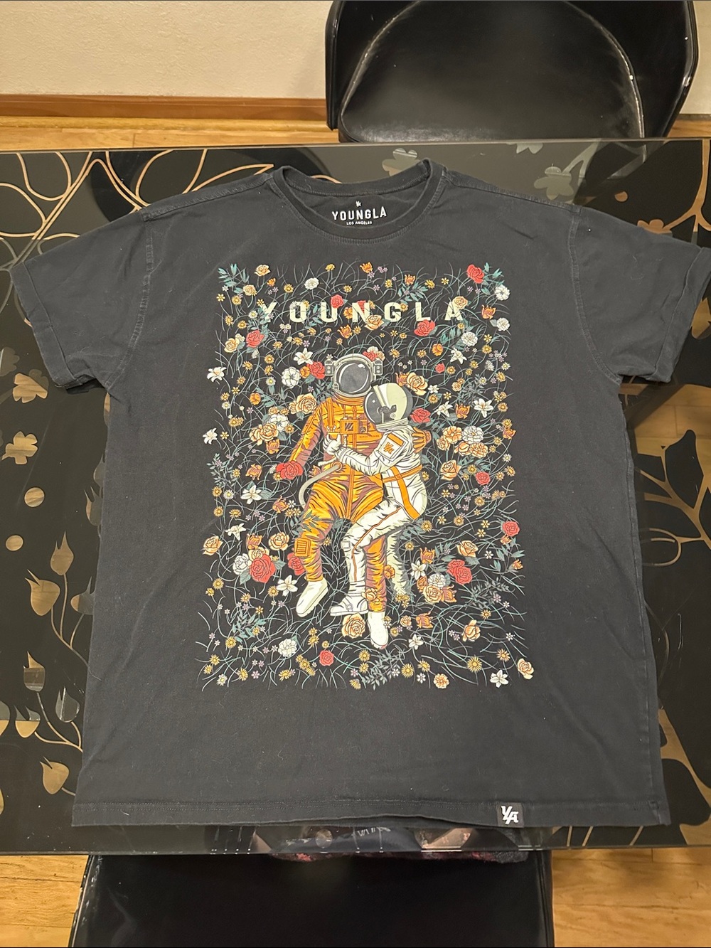 YoungLA Black Tee with Orange Astronaut and Floral Graphic